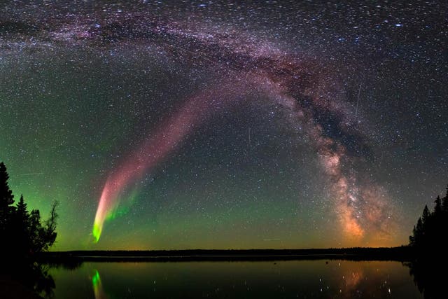 <p>Representational Image: The Strong Thermal Emission Velocity Enhancement, visible as a pink band rising from the lower left to upper right of this photograph, appears with the Milky Way over Childs Lake, Manitoba, Canada.</p>