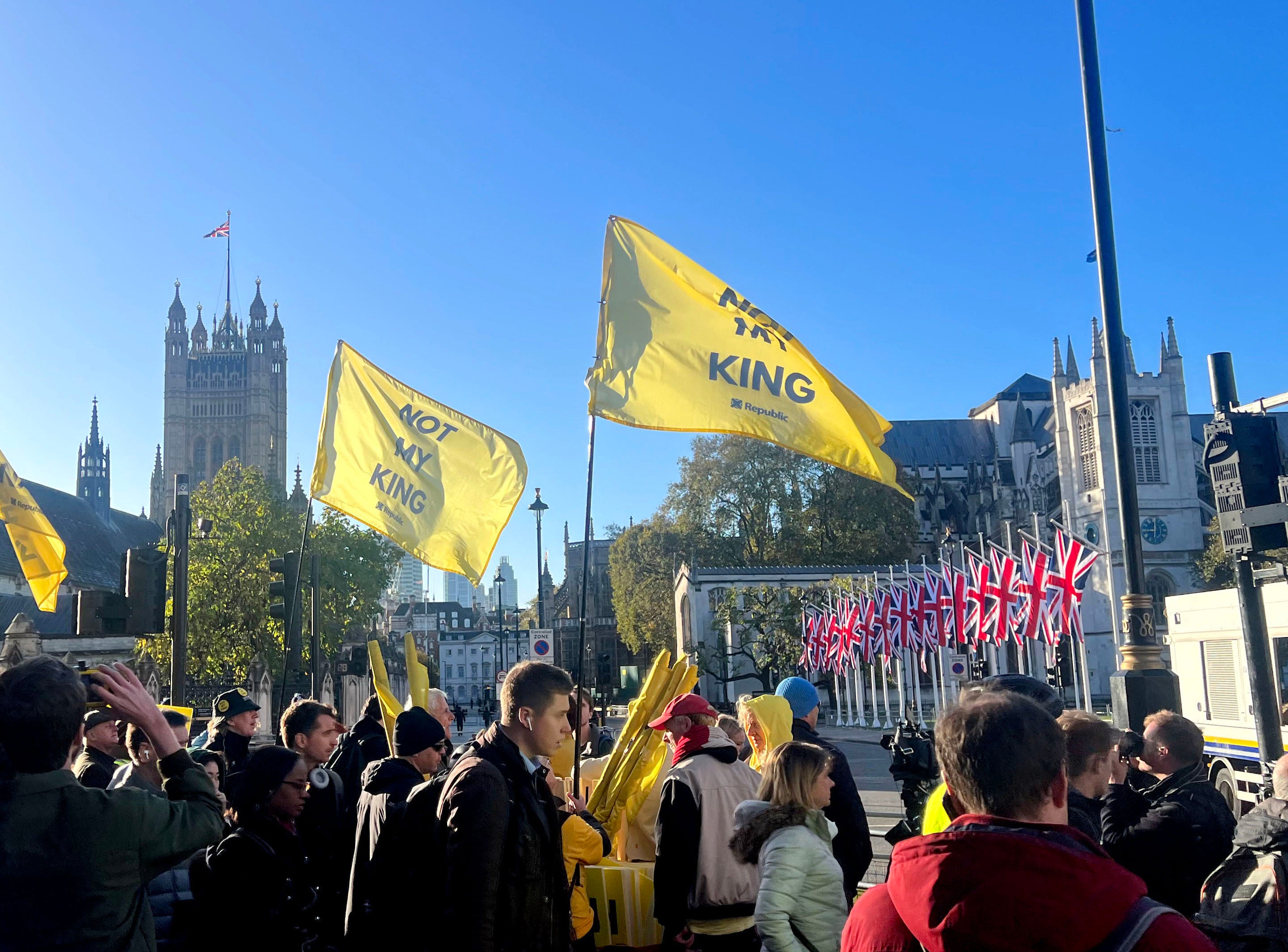 <p>Anti-Monarchy pressure group Republic fly "Not My King" flags in protest outside the Palace of Westminster</p>