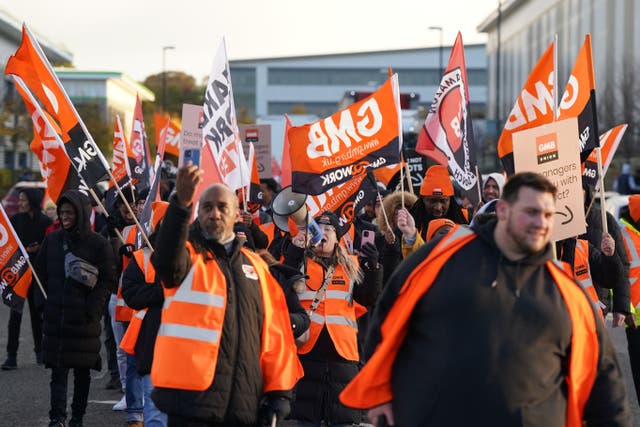 Members of the GMB union on the picket line outside the Amazon fulfilment centre in Coventry (Jacob King/PA)