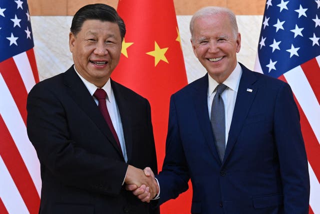 <p>File: US president Joe Biden (R) and China's President Xi Jinping (L) shake hands as they meet on the sidelines of the G20 Summit</p>