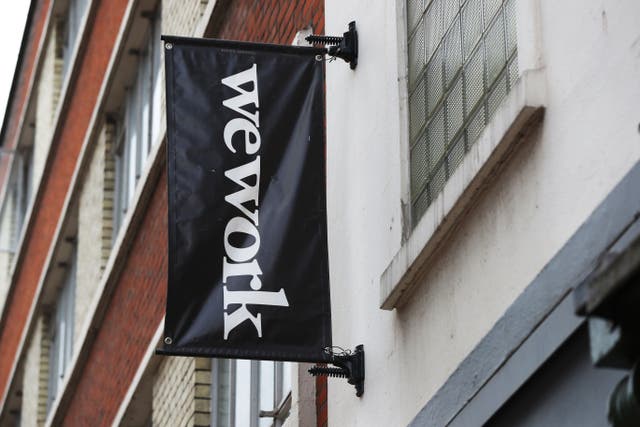Signage outside the co-working office space group, WeWork, at Chapel Street, London (Jonathan Brady/PA)