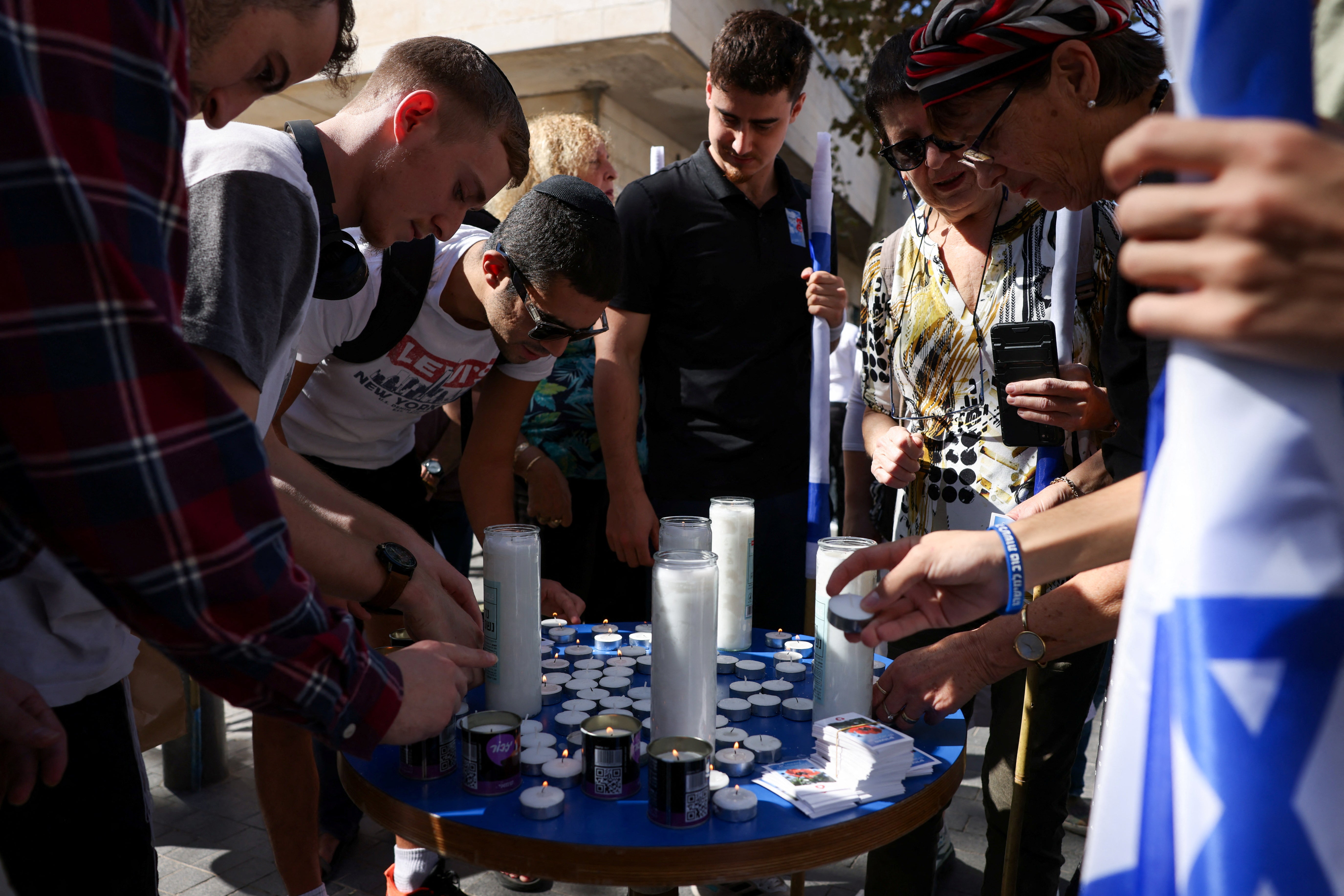 People light candles on the one-month anniversary of Hamas’s attack on Israel on 7 October which left 1,400 dead