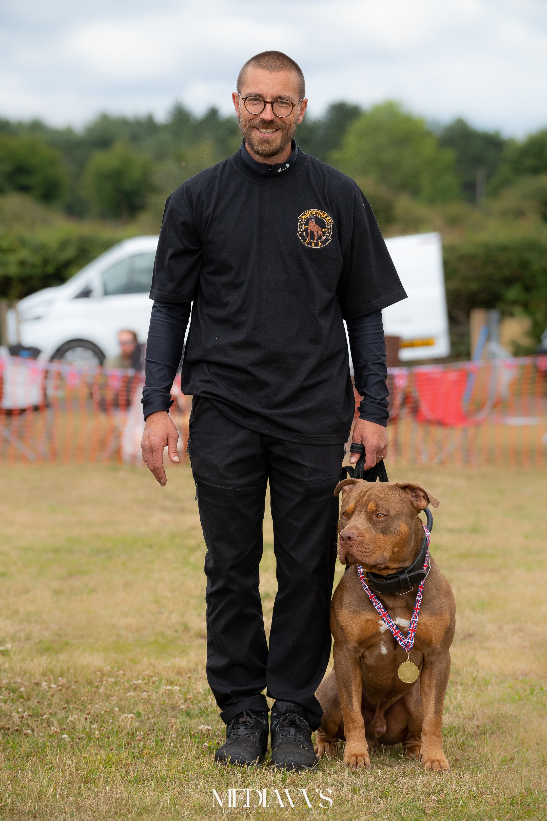 Professional dog trainer Chris Halls with his XL bully Odin, who has won awards in PSA competitions