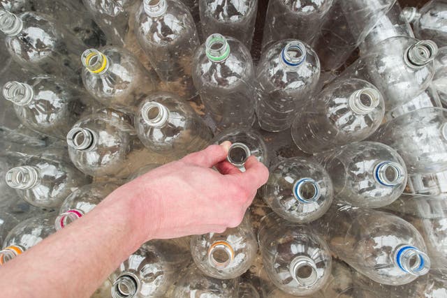 The multinationals have been accused of greenwashing over their plastic bottles recyclability claims (Jonathan Pow/PA)
