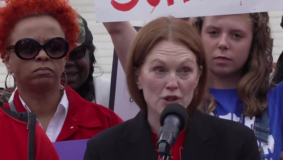 Julianne Moore joins gun control rally as Supreme Court considers law to protect domestic violence victims