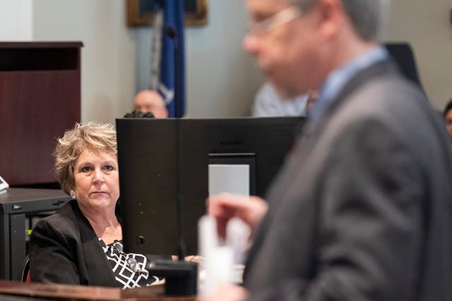 <p>Colleton County Clerk of Court Rebecca Hill listens as Prosecutor Creighton Waters makes closing arguments in Murdaugh’s trial </p>
