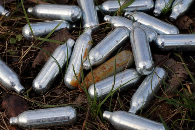 Canisters of nitrous oxide discarded by the side of a road in Kent (Gareth Fuller/PA)