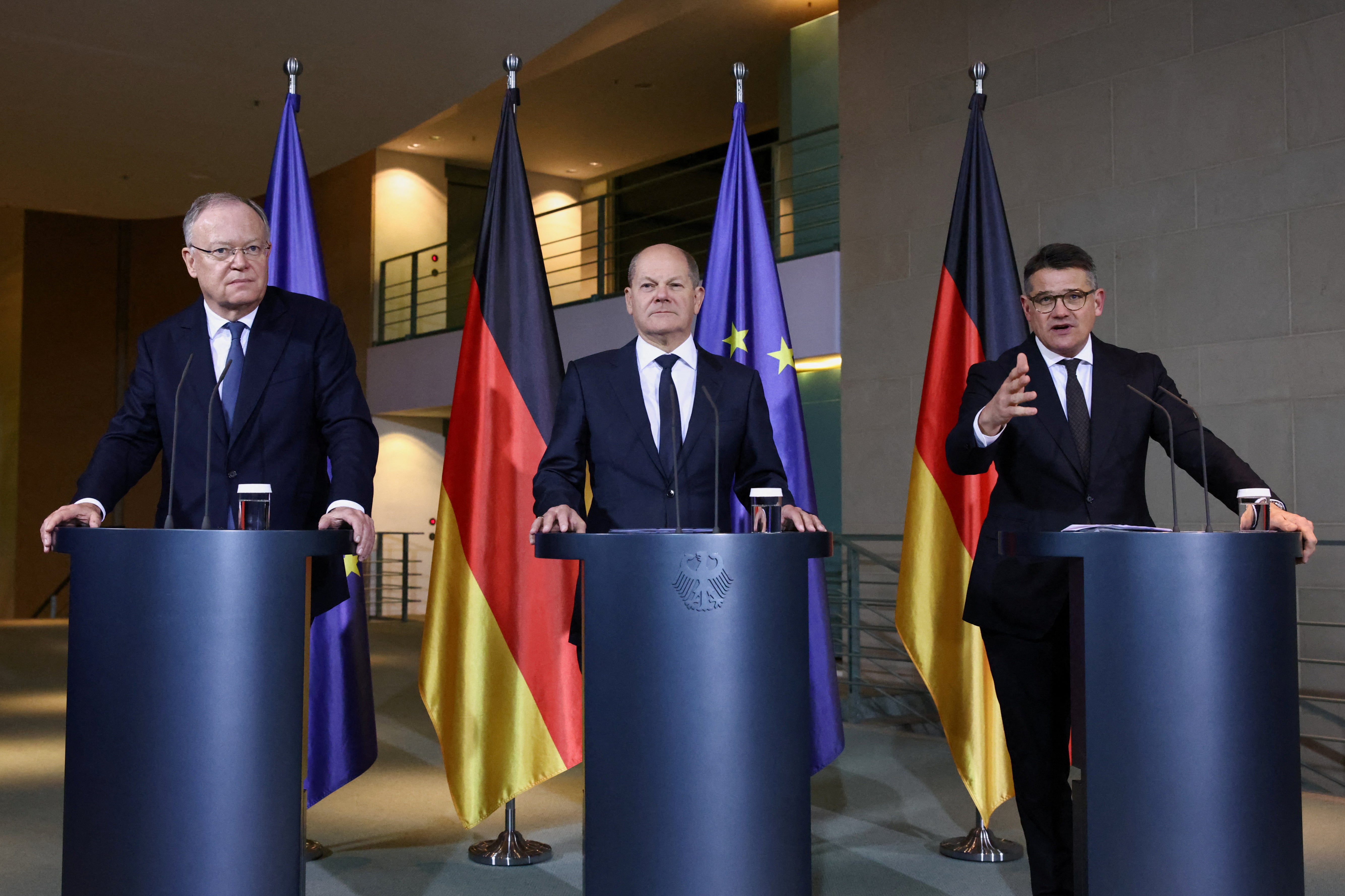 Chancellor Olaf Scholz, centre, with leaders of German states