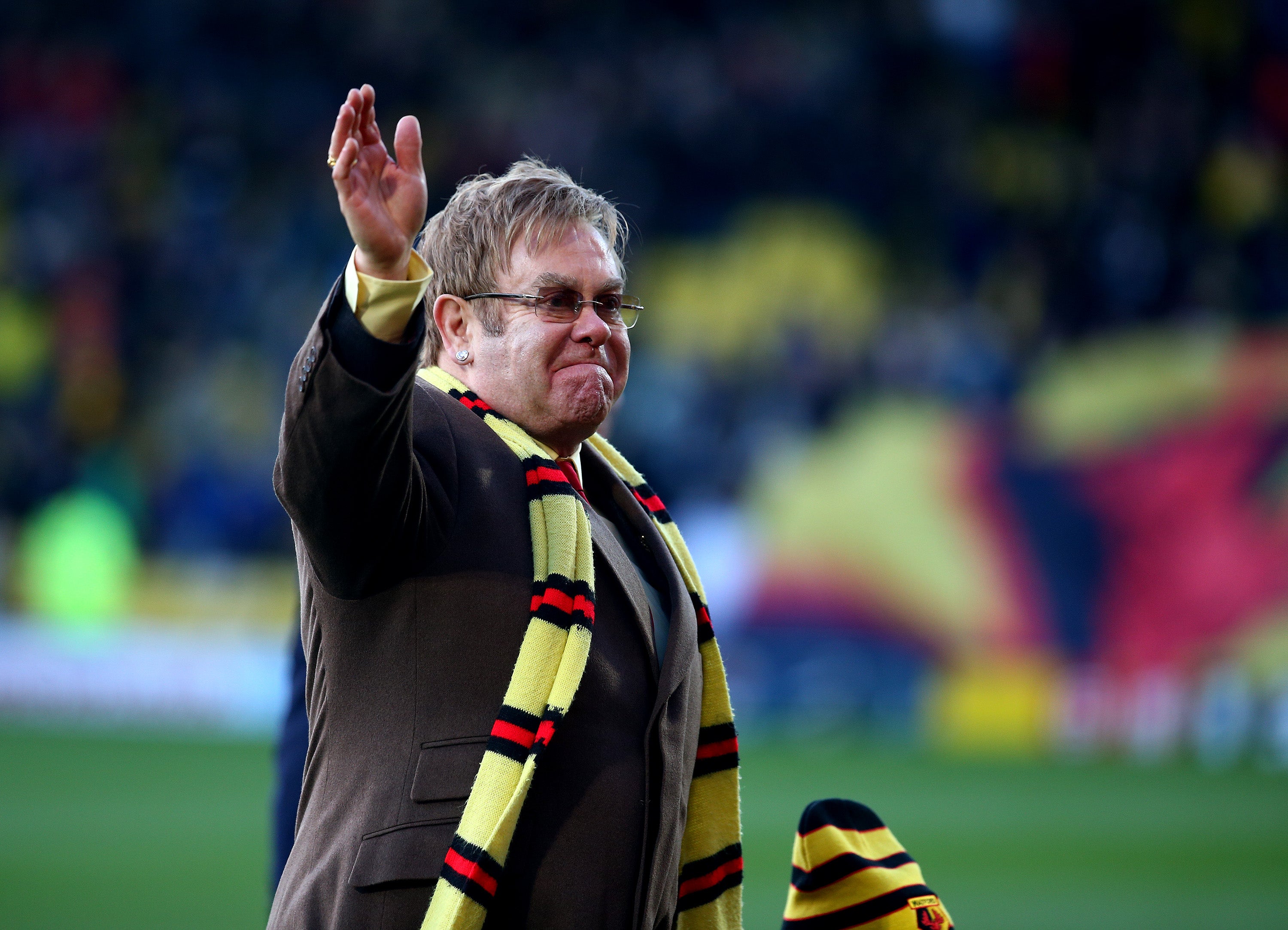 Watford honorary life president Sir Elton John helping unveil a stand in his name at Vicarage Road on 13 December 2014