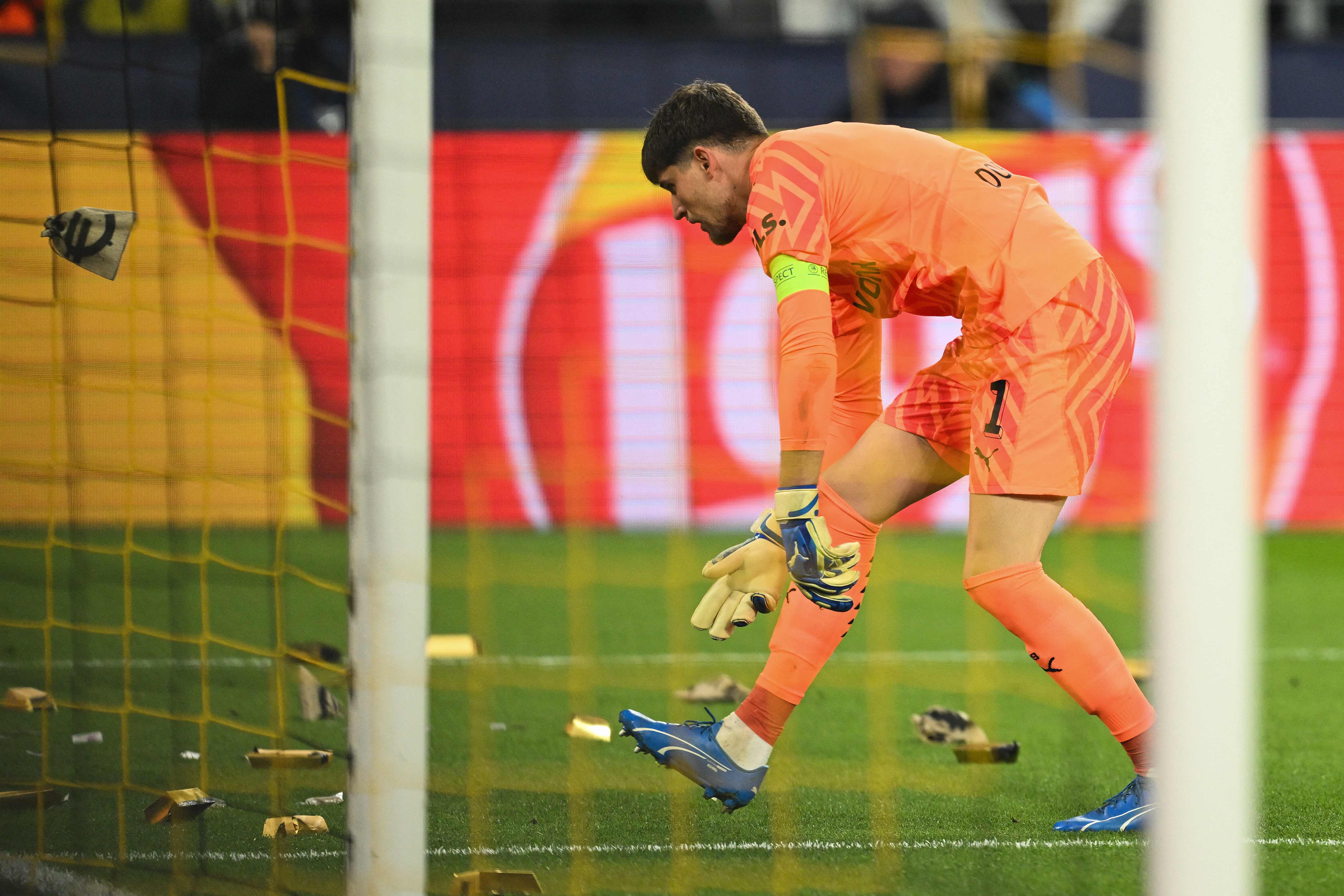 Gold bars made of cardboard were thrown on to the pitch by Dortmund fans