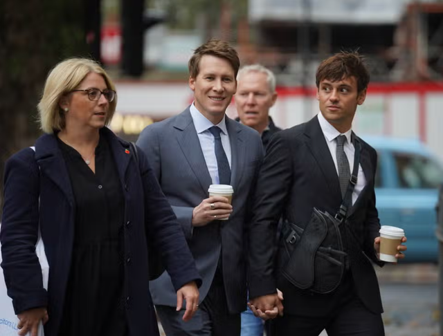 <p>Dustin Lance Black (C) was supported by his Olympic diving champion husband Tom Daley </p>