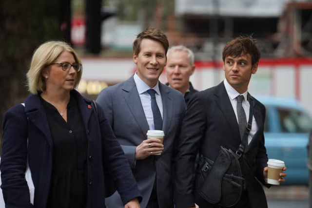 <p>Dustin Lance Black (C) was supported by his Olympic diving champion husband Tom Daley </p>