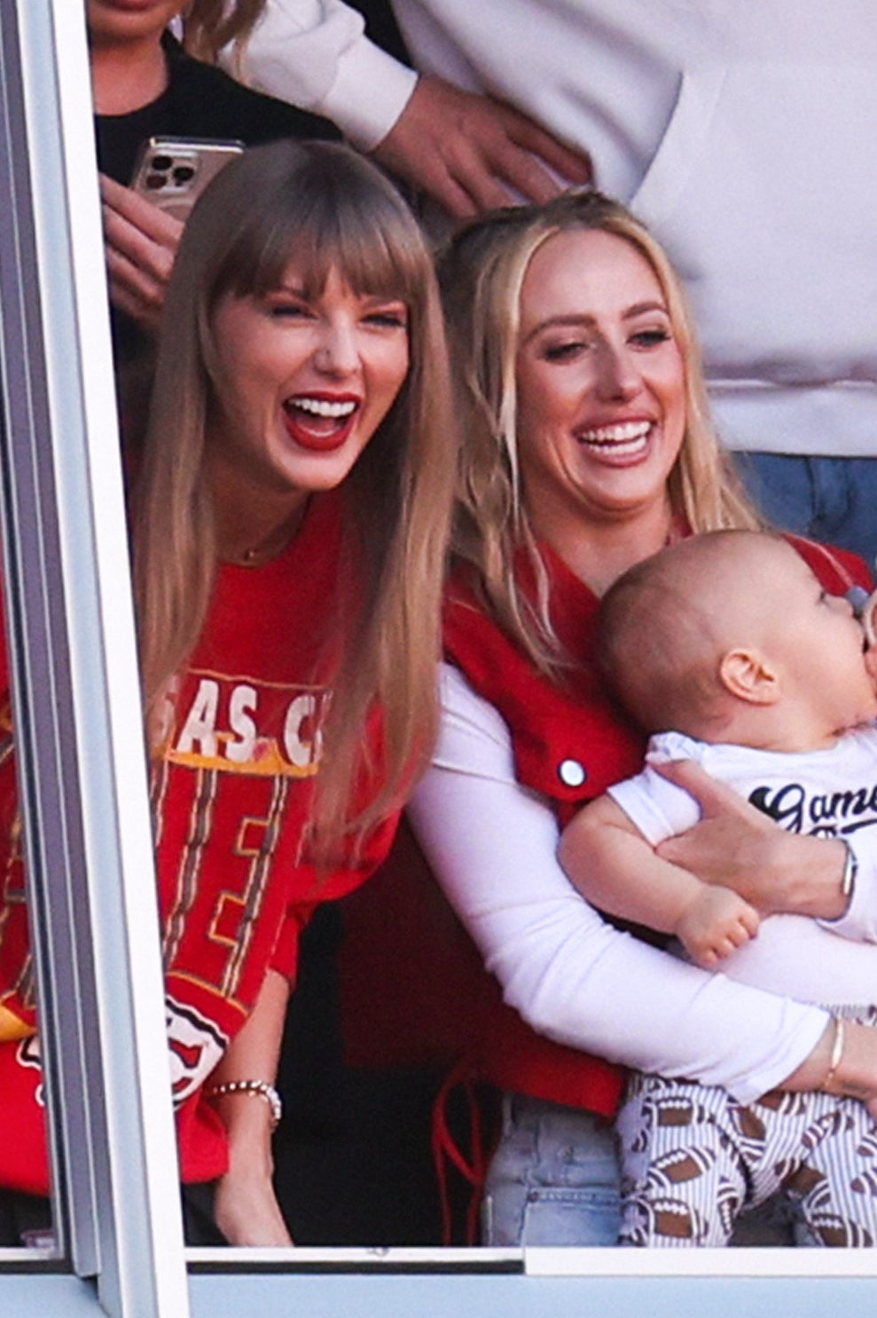 Big lols: Swift attends an American football game with new BFF Brittany Mahomes in October