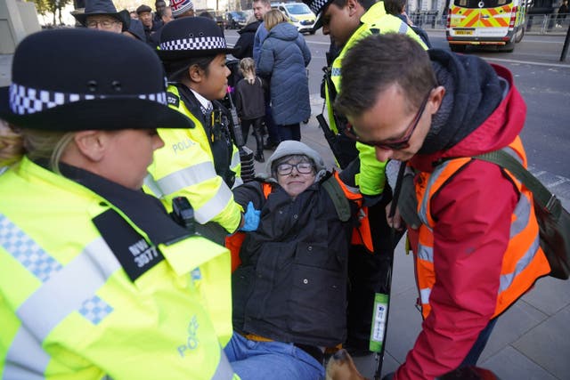 The Metropolitan Police and Just Stop Oil have accused each other of blocking an ambulance during a slow march by climate activists on Waterloo Bridge (Lucy North/PA)