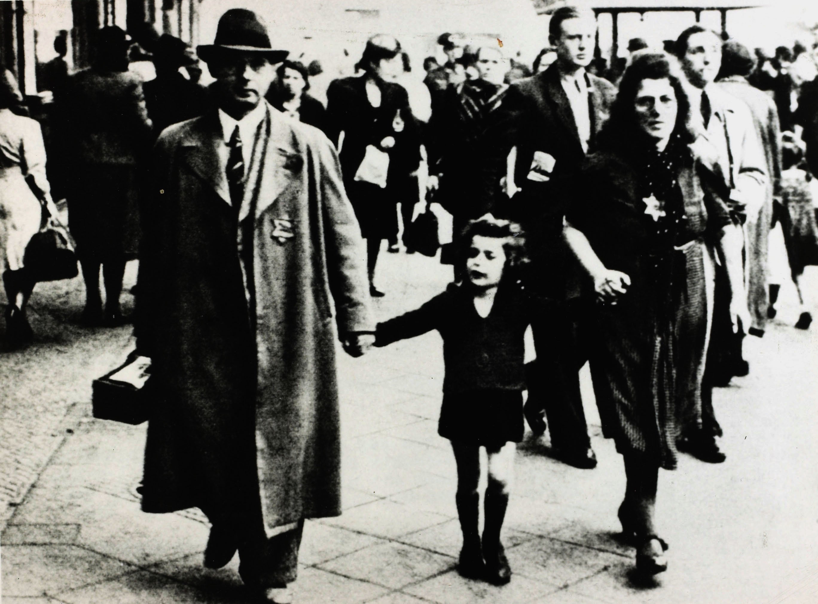 A family wear the Star of David to indicate they are Jews, in 1938: a commonplace sight in Germany after Kristallnacht