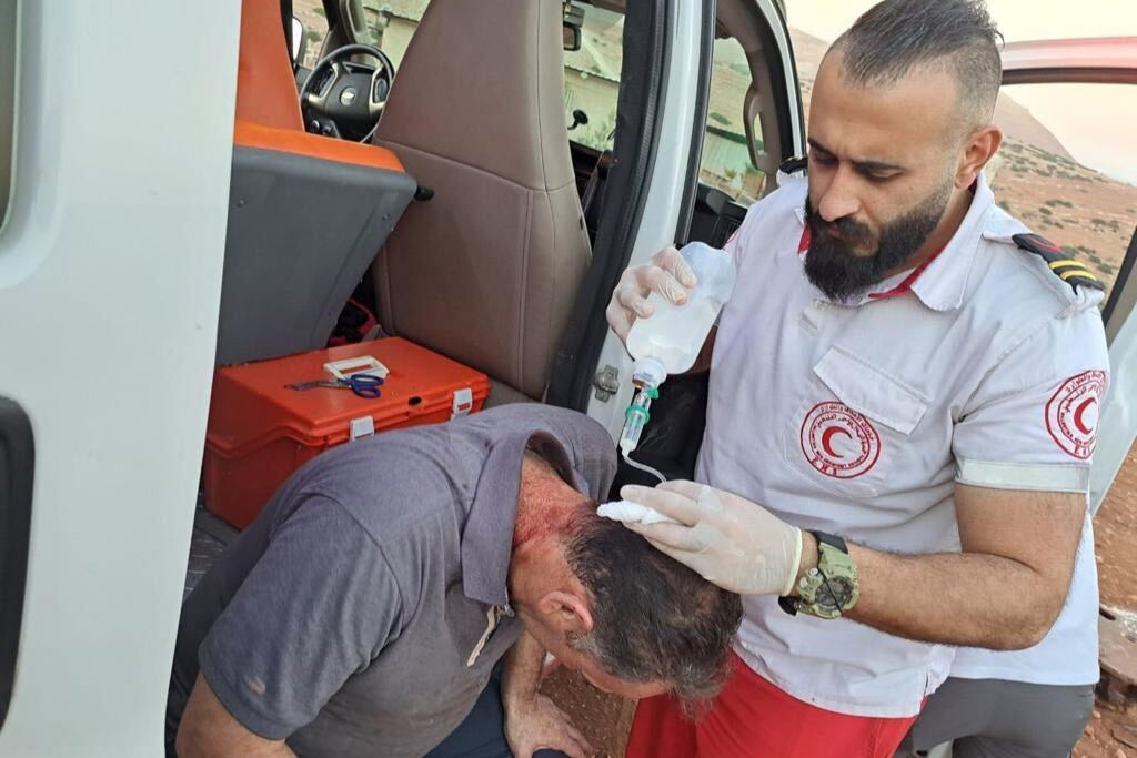 Jihad Mosaied receives treatment after settlers came to his village