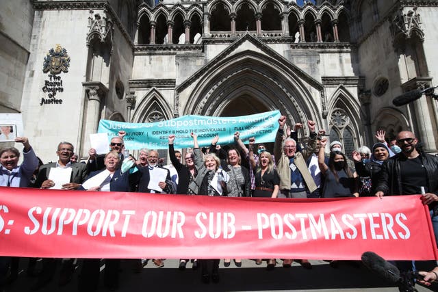 Former post office workers celebrate outside the Royal Courts of Justice after having their convictions overturned by the Court of Appeal (Yui Mok/PA)