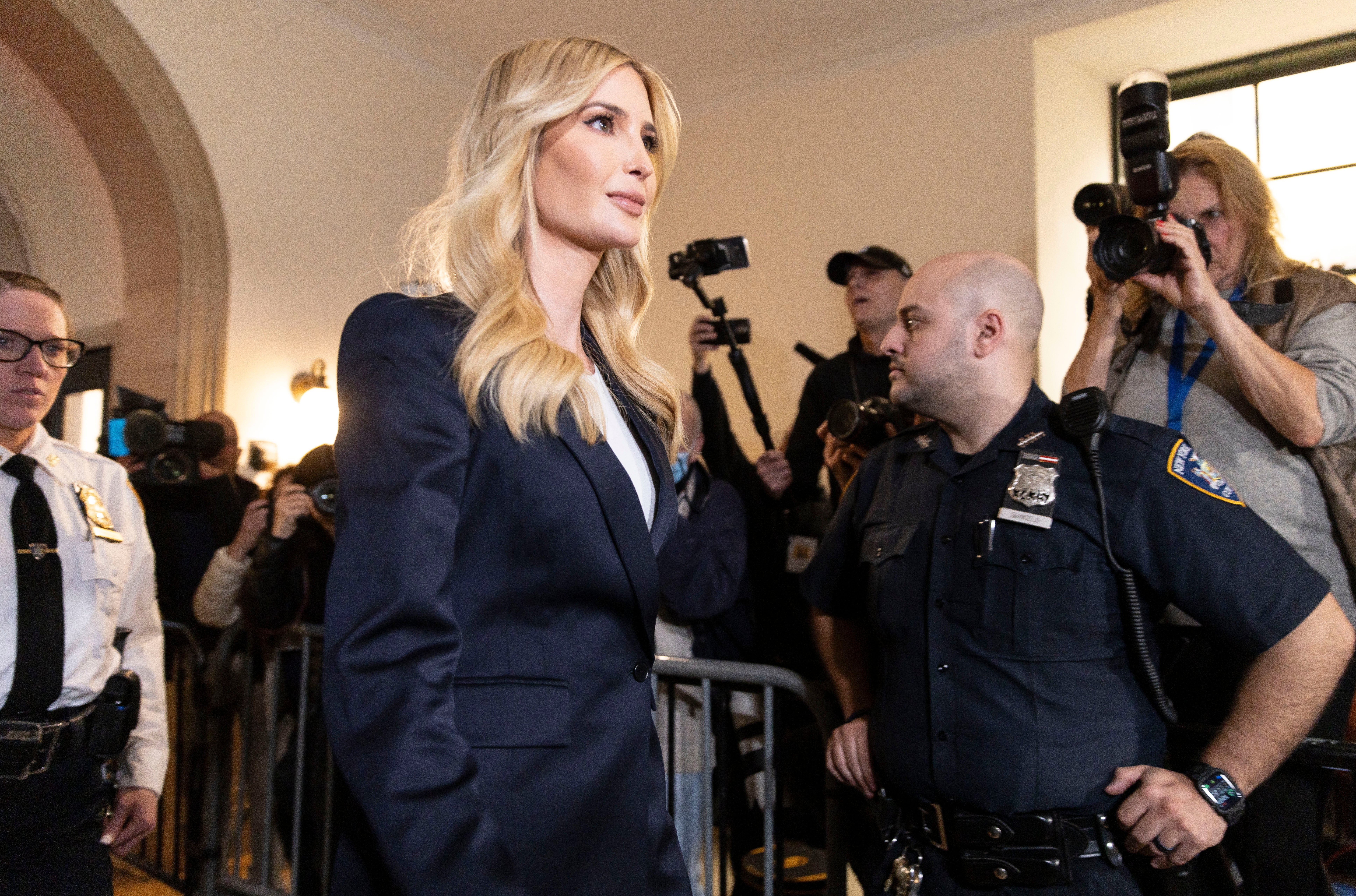 Ivanka Trump arrives at the doors of Judge Arthur Engoron’s courtroom on 8 November to testify in a fraud trial targeting her family’s business. Cameras are not allowed inside the courtroom
