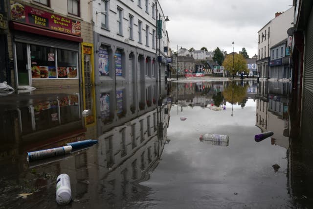 A view of debris and flood water in Sugar Island as the clear up begins in Newry Town, Co Down (Brian Lawless/PA)