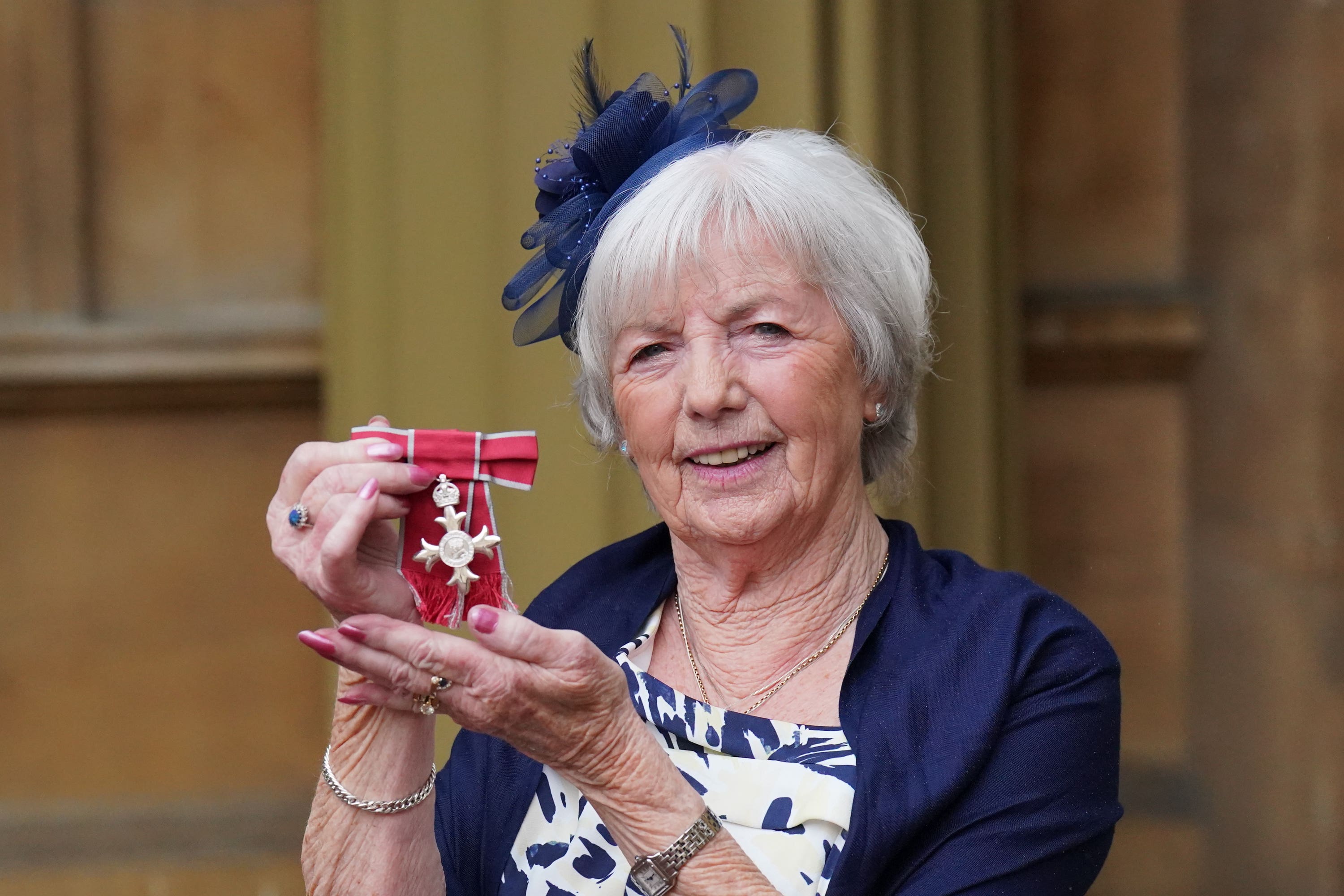 Campaigner for Helen’s Law Mary McCourt with her MBE at an investiture ceremony at Buckingham Palace (Jonathan Brady/PA)