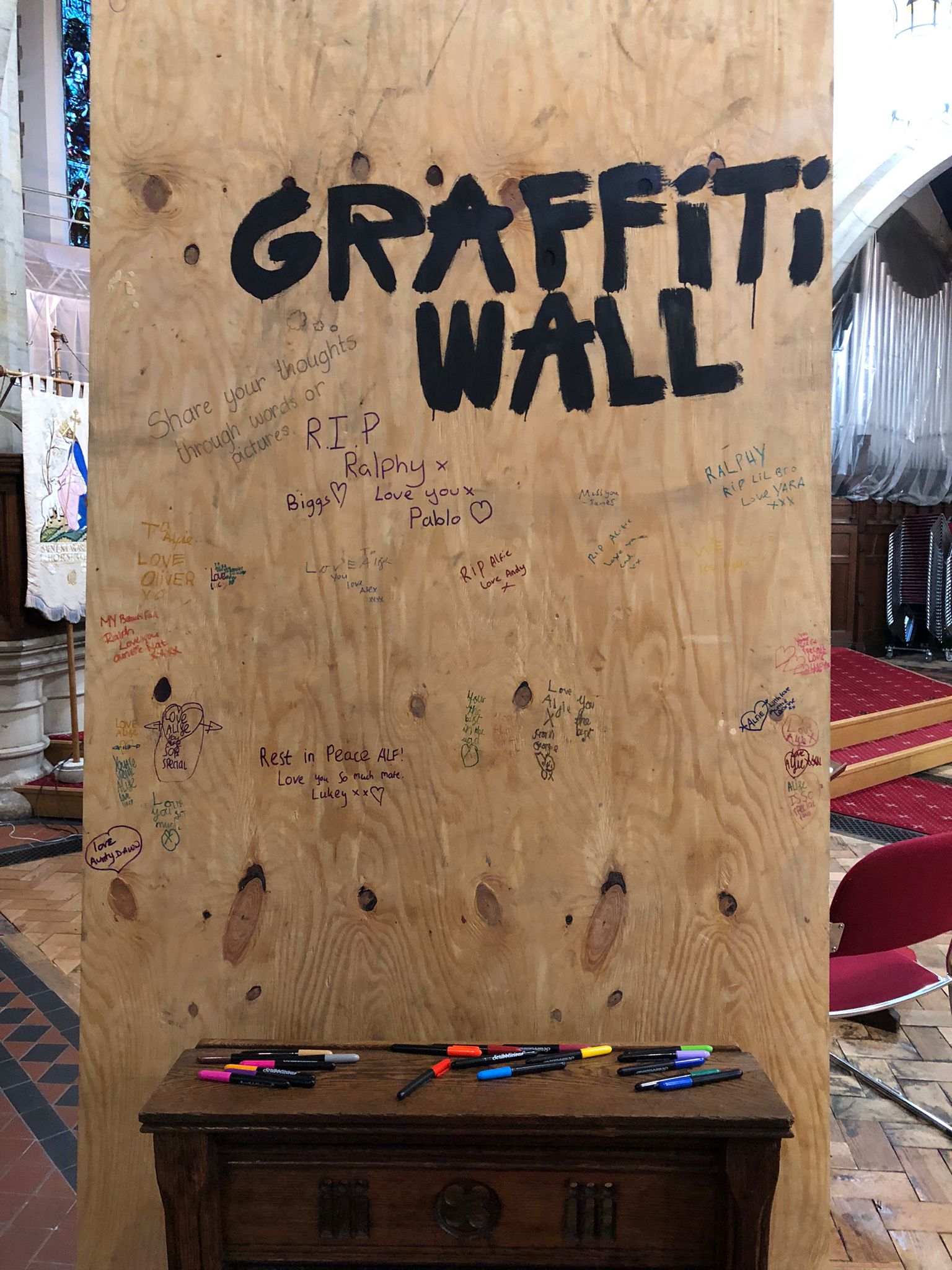 A graffiti wall was covered with messages for Alfie at St Margaret’s Church