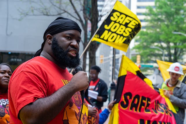 <p>Gerald Green, a Waffle House cook, speaks at a rally for staff at which they called for better security in restaurants and a $25 per hour minimum wage. </p>