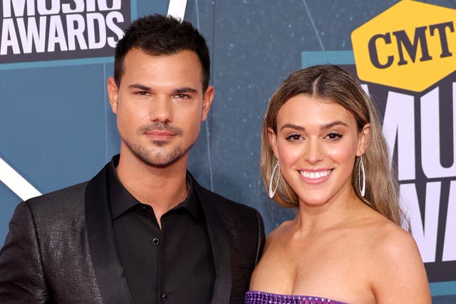 <p>Taylor Lautner and Taylor Dome attend the 2022 CMT Music Awards at Nashville Municipal Auditorium on 11 April 2022 in Nashville, Tennessee. </p>
