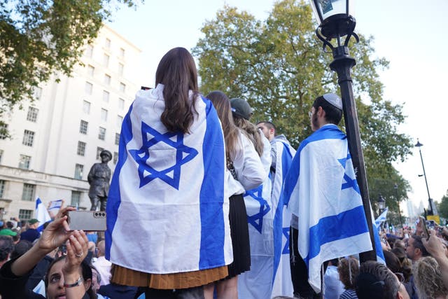 People attending a vigil outside Downing Street, central London, for victims and hostages of Hamas attacks (Lucy North/PA)