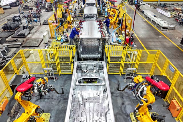 <p>Representational image: Robotic arms weld parts of electric express delivery vehicles on the assembly line at a factory</p>