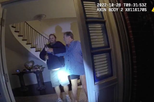 <p>In this image taken from San Francisco Police Department body-camera video, the husband of former U.S. House Speaker Nancy Pelosi, Paul Pelosi, right, fights for control of a hammer with his assailant David DePape during a brutal attack in the couple's San Francisco home on Oct. 28, 2022. Opening statements are scheduled for Thursday, Nov. 8, 2023, in the federal trial of the man accused of breaking into former House Speaker Nancy Pelosi's San Francisco home seeking to kidnap her and bludgeoning her husband with a hammer</p>