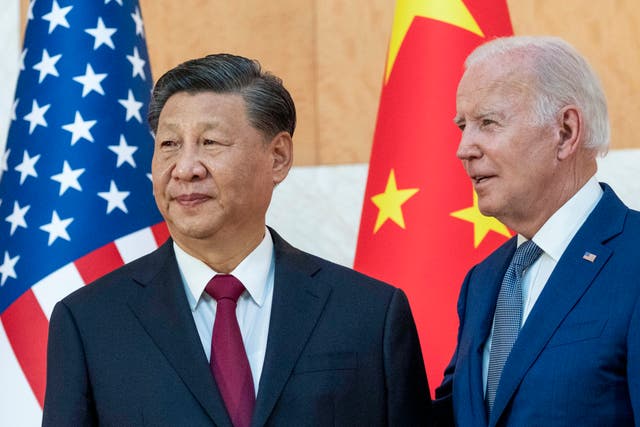 <p>File: President Joe Biden, right, stands with Chinese president Xi Jinping before a meeting on the sidelines of the 2022 G20 leaders’ summit </p>