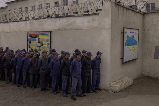 <p>Representative image: Russian prisoners of war queue for lunch at a camp for Russian POWs in western Ukraine</p>