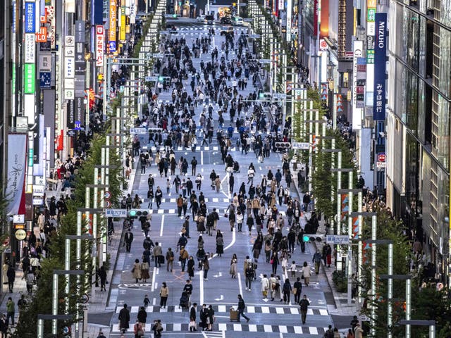 <p>File. People walking on a street in Tokyo’s Ginza area at dusk </p>