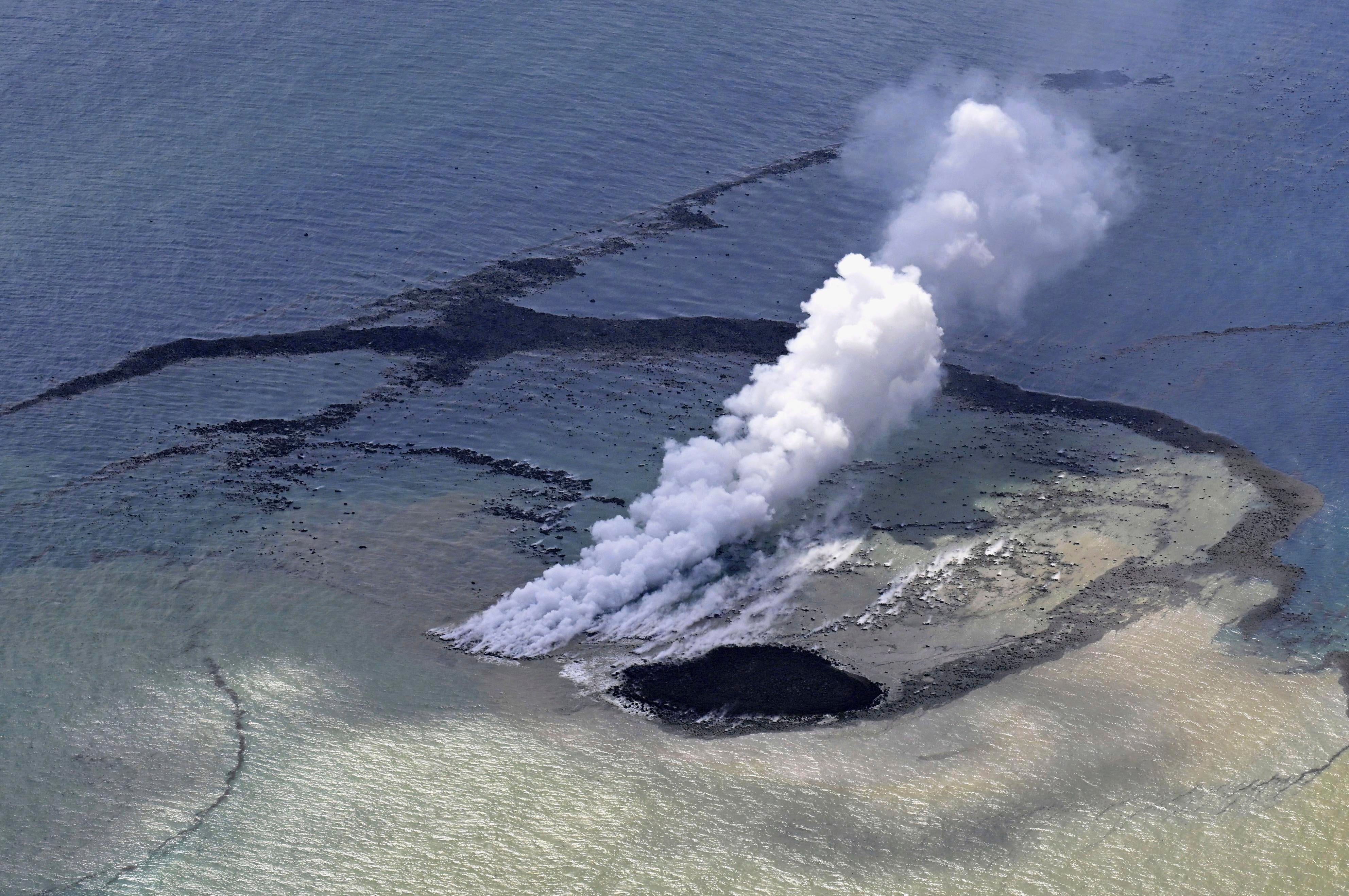 The new island formed by erupted rock