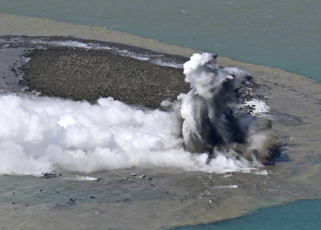 <p>This aerial photo shows steam billowing from the waters off Iwoto Island, Ogasawara town in the Pacific Ocean</p>