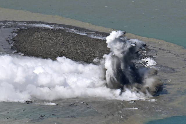 <p>This aerial photo shows steam billowing from the waters off Iwoto Island, Ogasawara town in the Pacific Ocean</p>