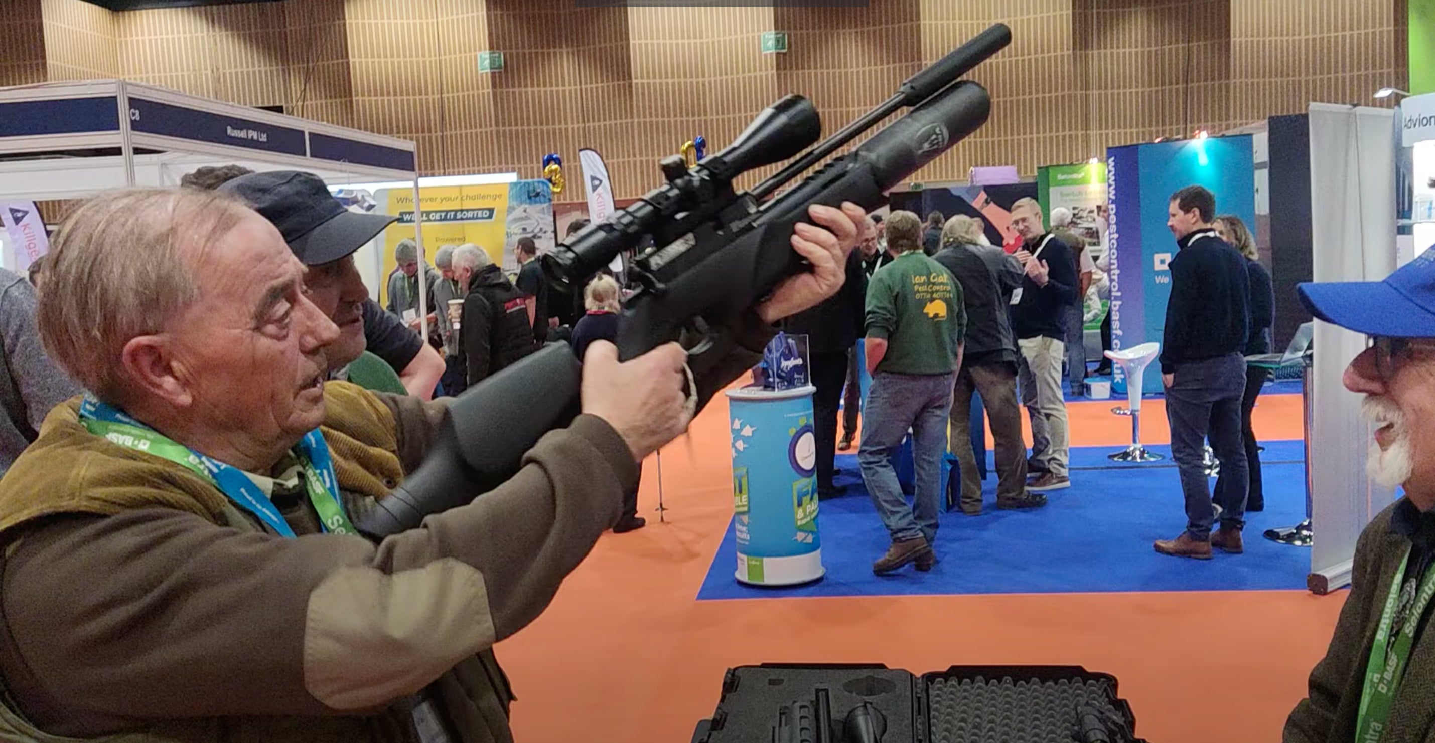 David Mills allows his prototype air rifle to be tested by a potential buyer hoping to tackle other types of pests