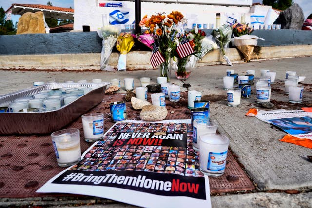 <p>Flowers and candles are left at a makeshift shrine placed at the scene of a Sunday confrontation that lead to death of a demonstrator, Tuesday, Nov. 7, 2023, in Thousand Oaks, Calif.</p>