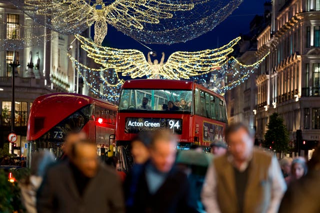 <p>Hurry, hurry: Christmas shoppers on London’s Regent Street (PA)</p>