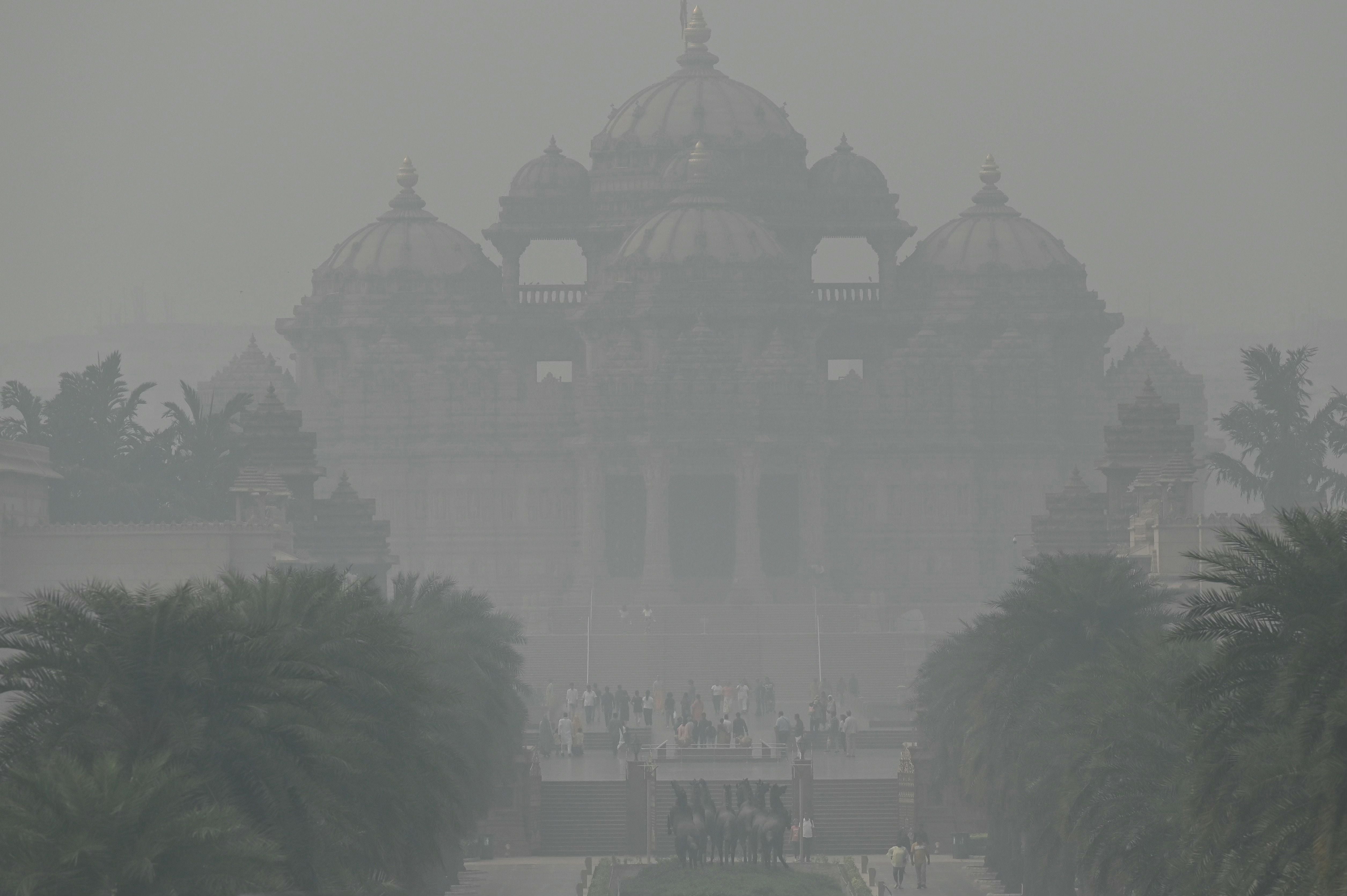 The Akshardham temple is seen amid heavy smog conditions in New Delhi on 9 November