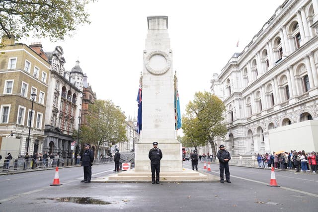 <p>Metropolitan Police officers on duty beside the Cenotaph on Whitehall, central London, on Friday, ahead of marches planned for the centre of the city on Saturday</p>