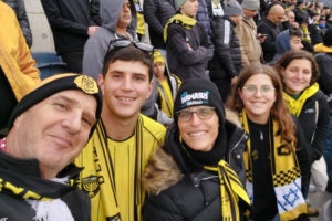 Father Ori, Netta, Ayelet, and sisters Alma-Ruth and Rona Epstein at a Beitar Jerusalem football match