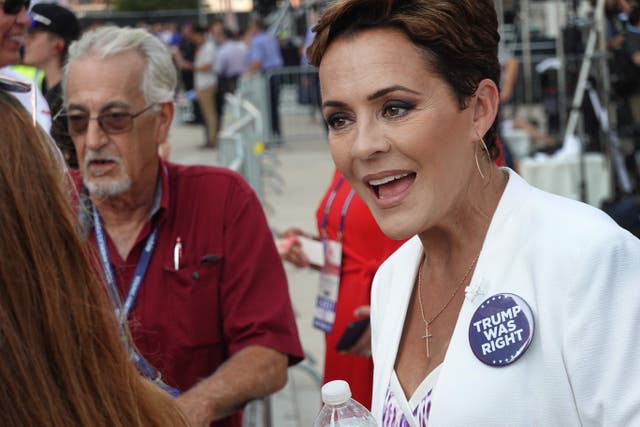 <p>Former Arizona gubernatorial candidate and supporter of former President Donald Trump Kari Lake greets people outside of the Fiserv Forum before the start of the first GOP presidential debate on August 23, 2023 in Milwaukee, Wisconsin. </p>