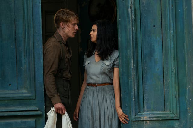 <p>Louis Hofmann and Aria Mia Loberti in ‘All the Light We Cannot See’</p>