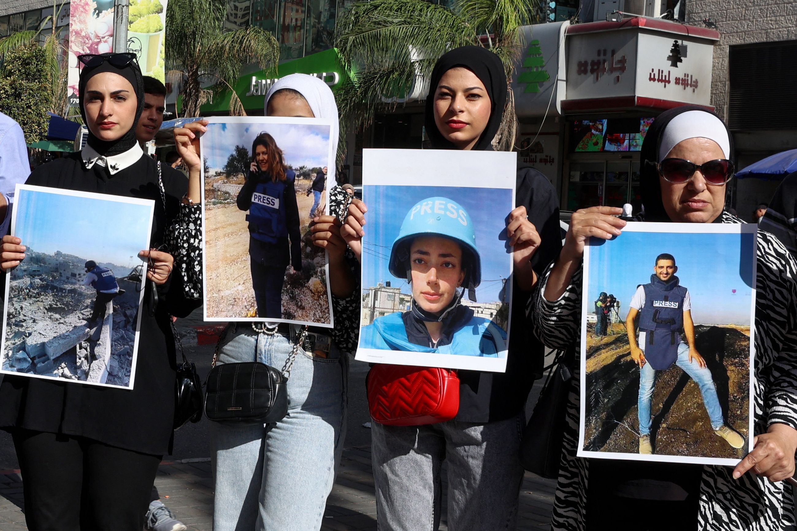 Palestinians rally in the West Bank city of Nablus on 6 November to support journalists in Gaza.