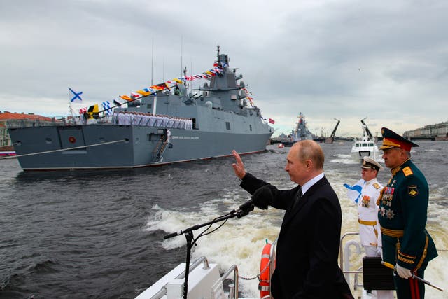 <p>File: Russian president Vladimir Putin, center, and Russian defence minister Sergei Shoigu, review warships</p>