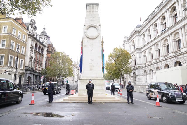 Metropolitan Police officers on duty beside the Cenotaph on Whitehall, central London (Stefan Rousseau/PA)