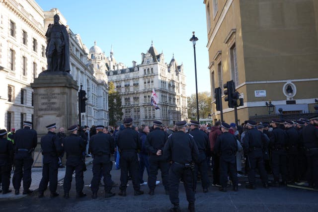 Police officers take their positions by the Cenotaph in Whitehall, central London (Jeff Moore/PA)