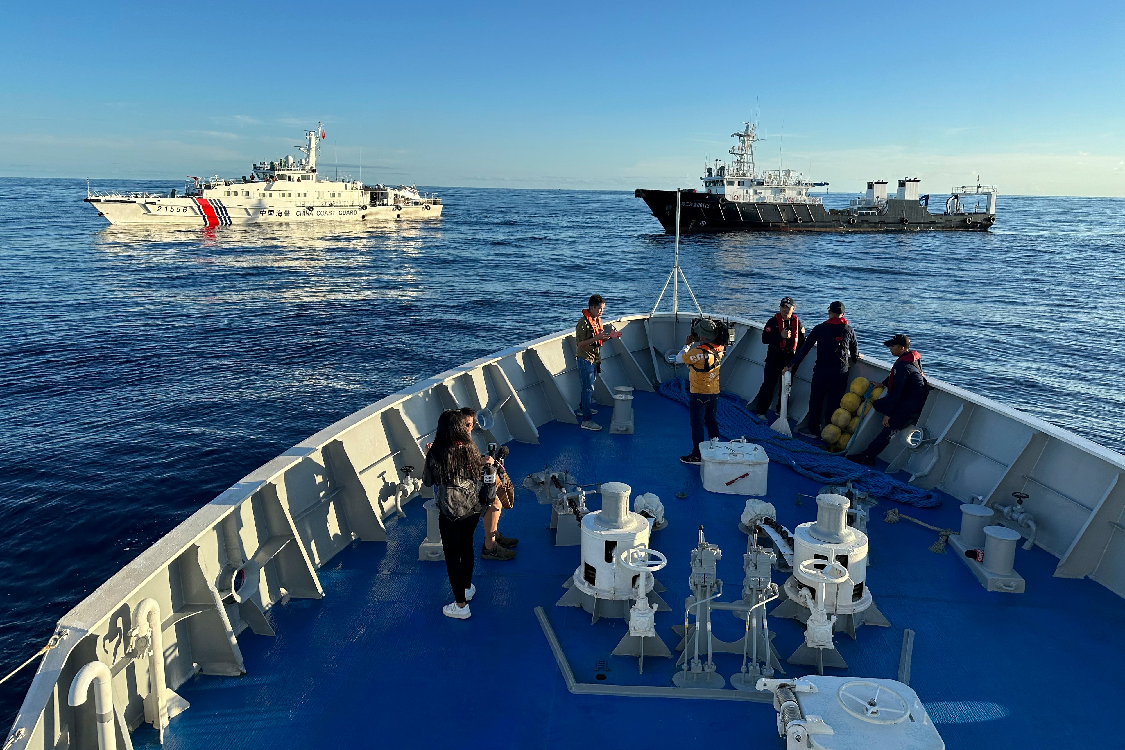 Dozens of Chinese ships chase Philippine vessels as US renews