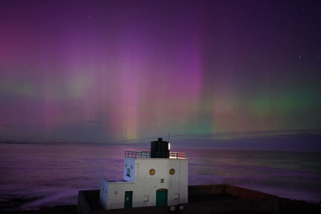 The aurora borealis, also known as the Northern Lights, could illuminate skies across the UK this weekend (Owen Humphreys/PA)